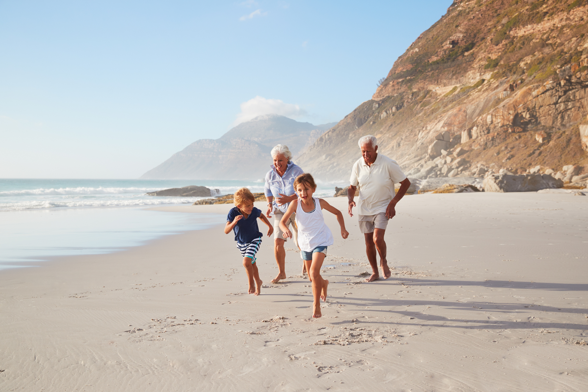 family playing on the beach