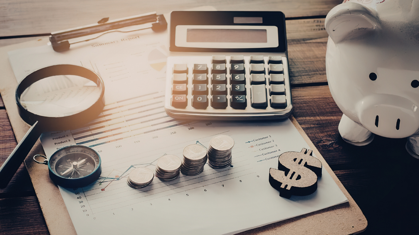 calculator and money on a desk