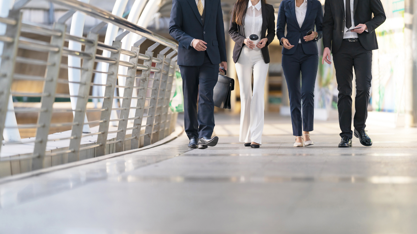 4 business people walking