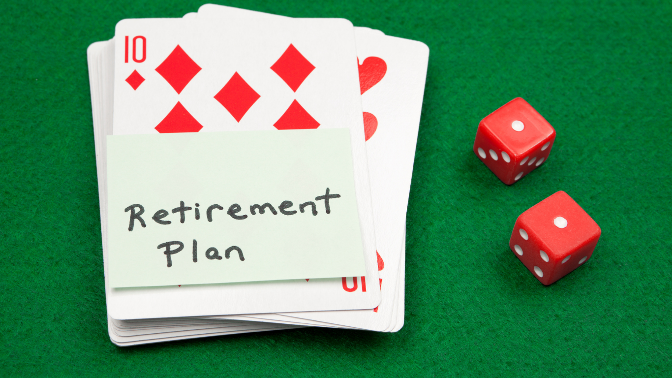 retirement plan written on a post it note on top of a deck of cards